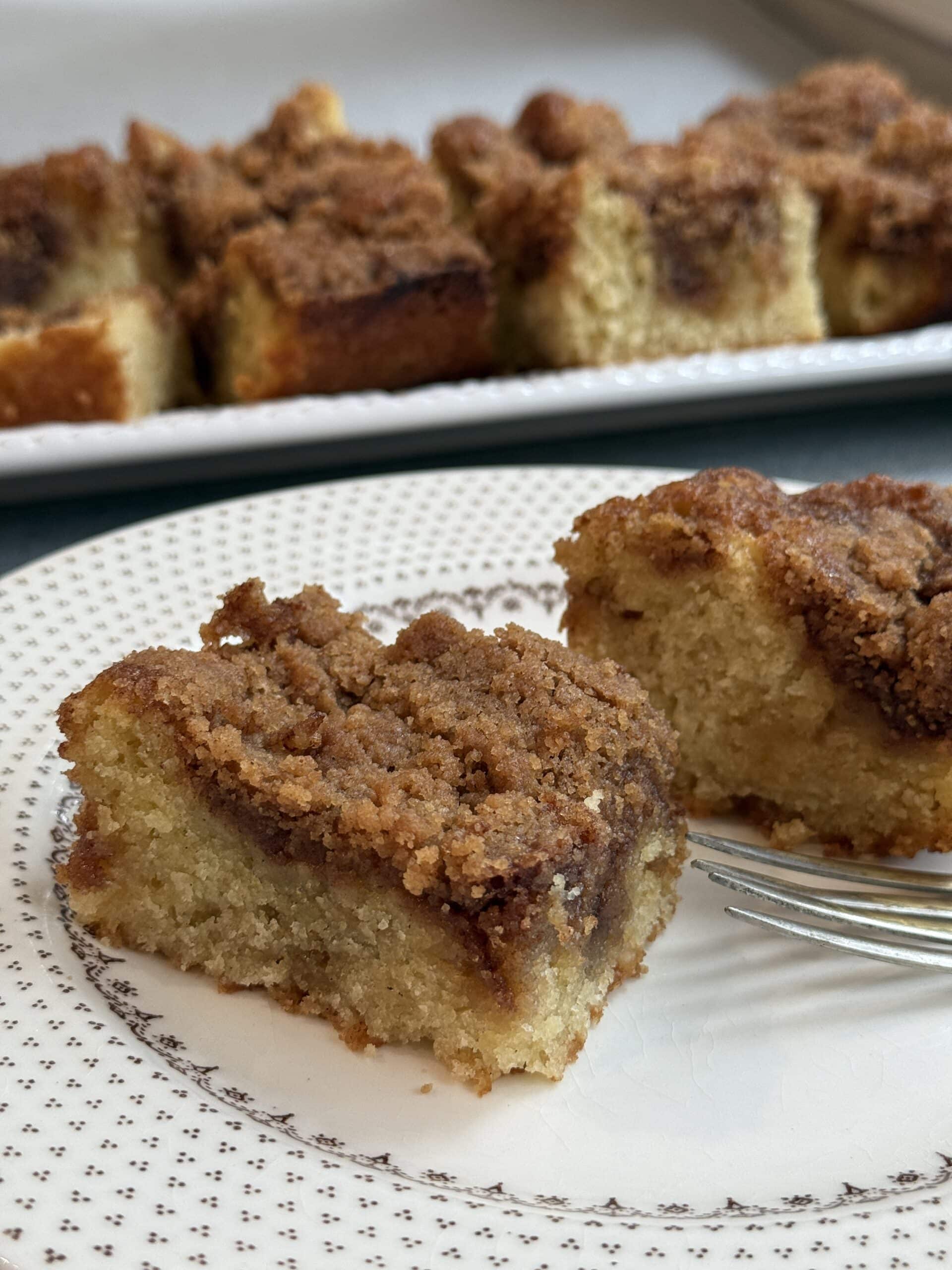 Close up of soft vanilla coffee cake with golden brown cinnamon topping