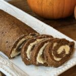 Close up of easy pumpkin roll with warm spices and a tight cream cheese spiral