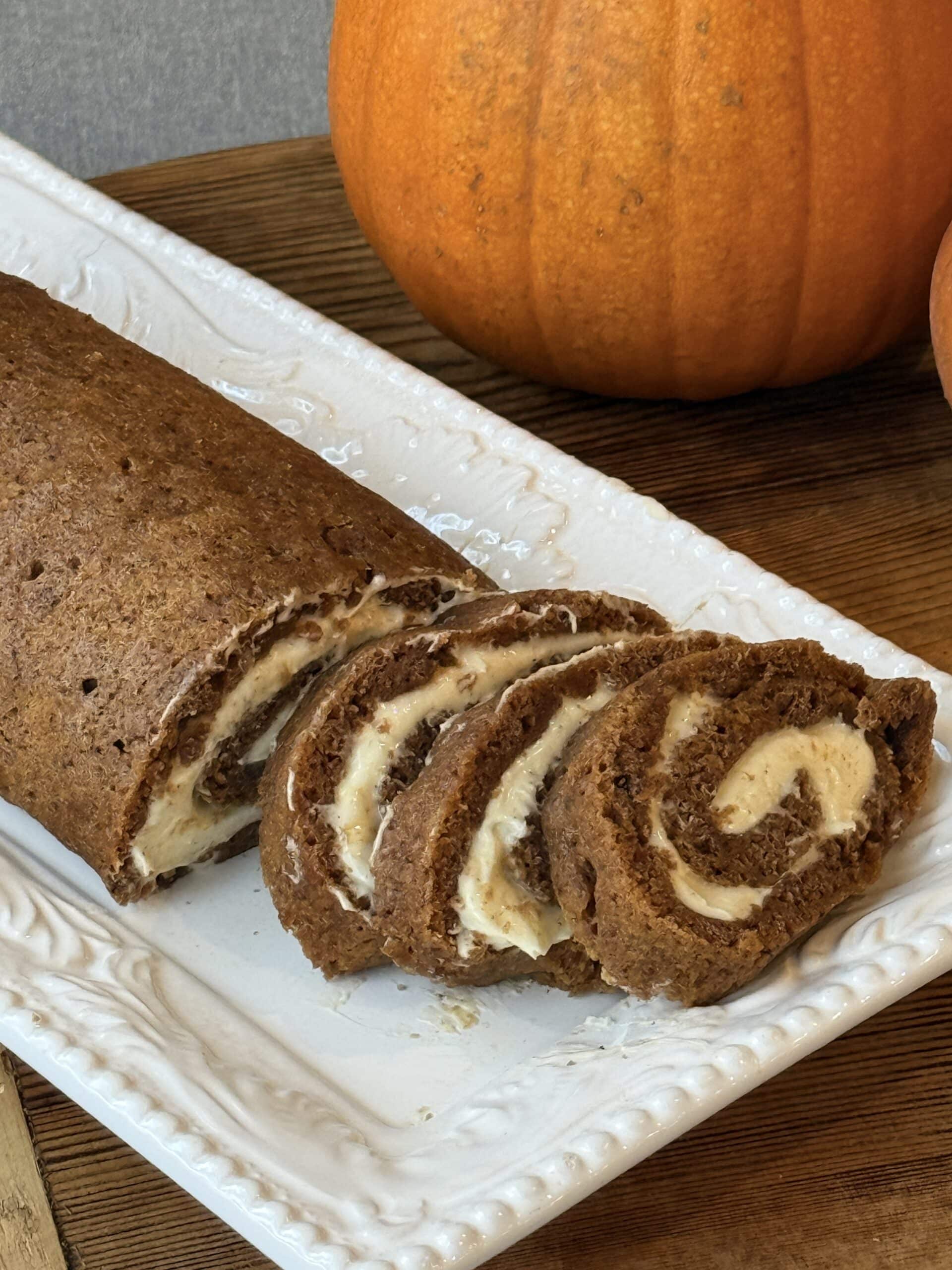 Close up of easy pumpkin roll with warm spices and a tight cream cheese spiral