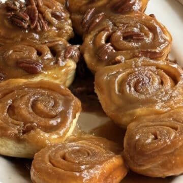 Classic homemade sticky buns turned out onto a serving plate and ready to serve