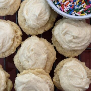 Soft vanilla bean sugar cookies with thick, tender centers and smooth frosting, baked and ready to serve.