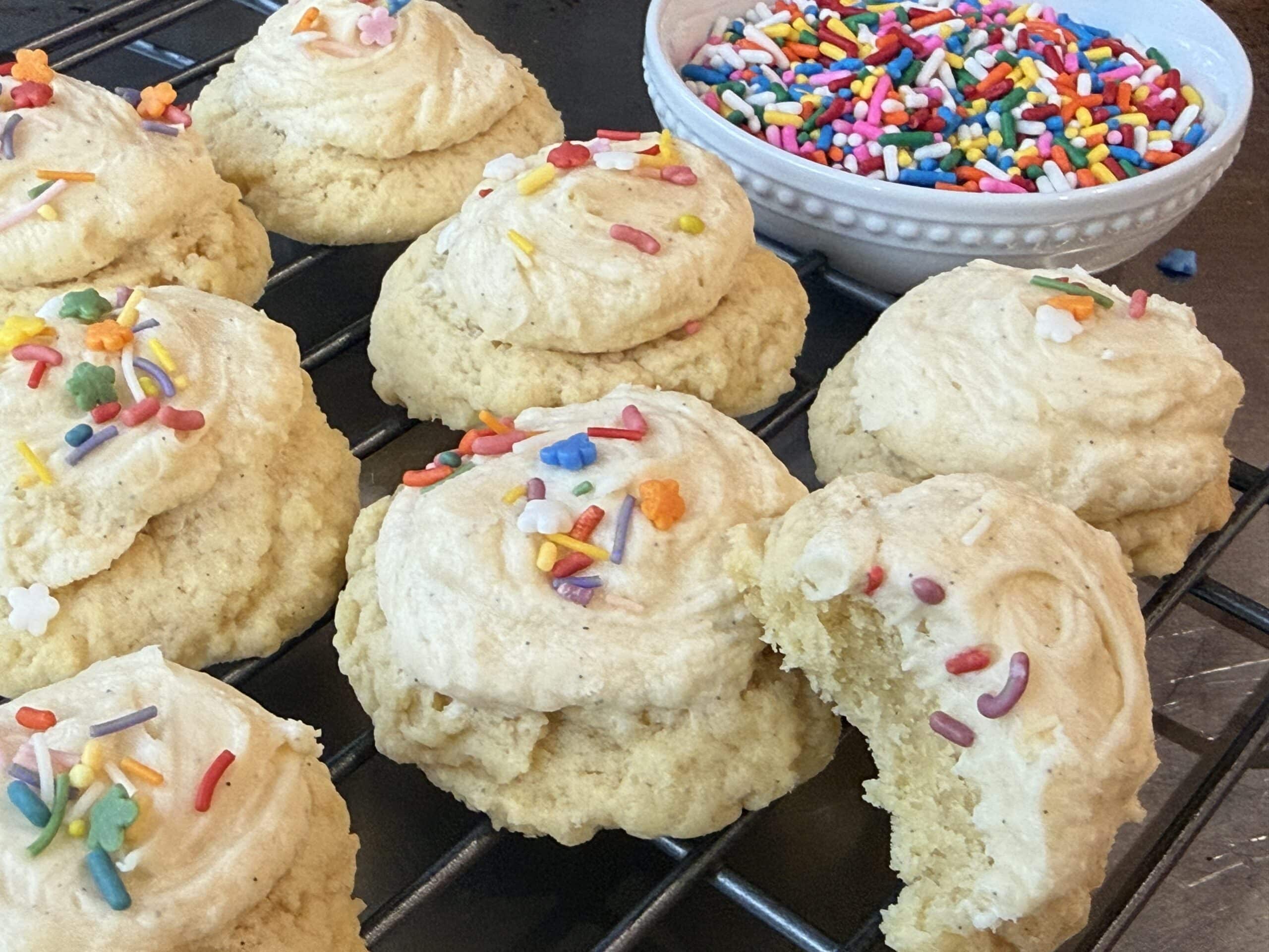 No chill sugar cookies baked soft and thick, topped with vanilla frosting and sprinkles