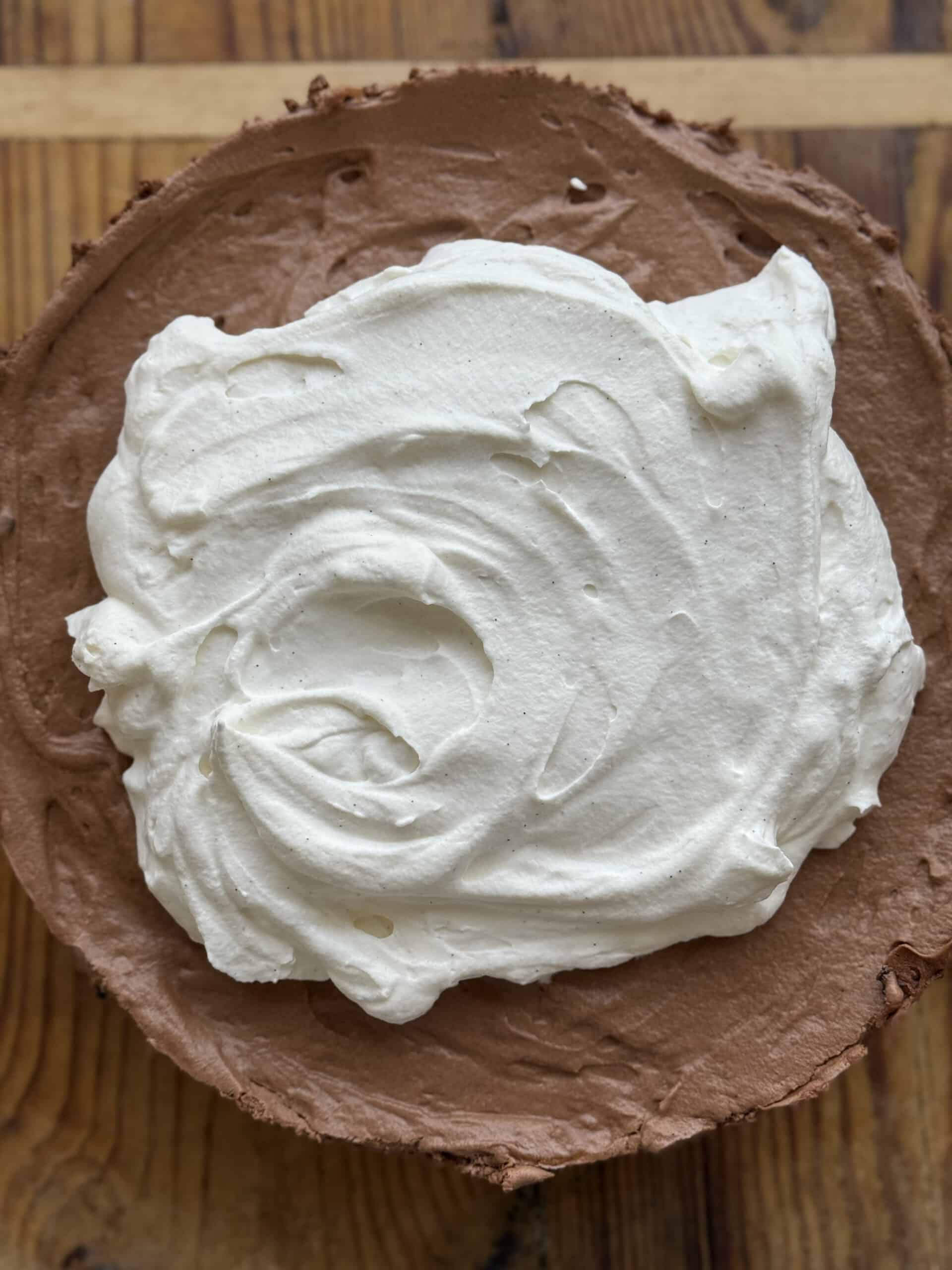 Close-up of creamy no-bake chocolate mousse pie with Oreo crust and soft whipped cream topping, perfect for Valentine's Day or Christmas